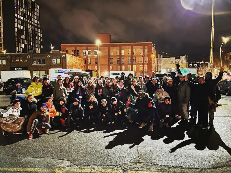 The Love on Hamilton outreach team gathered at night in downtown Hamilton, Ontario